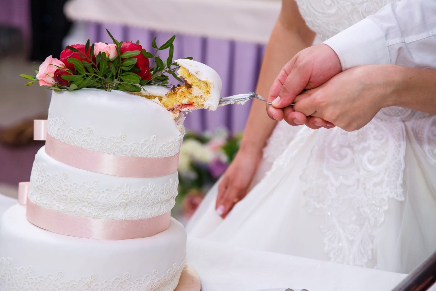 Modern custom wedding cake design with a sleek marble fondant finish and geometric tiers.