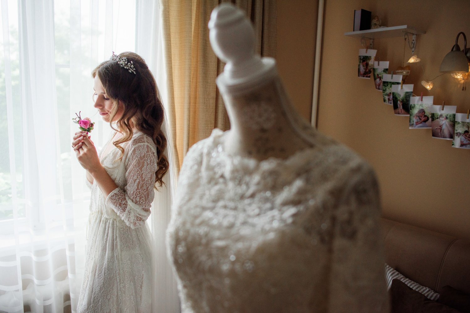 Wedding Dress Alterations: Hidden Costs and Fees the Quote May Not Show 21 Look from behind the wedding dress at pretty bride with a pink boutonniere