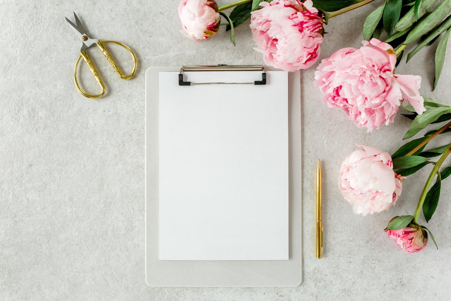 Wedding Website Privacy: What Nobody Mentions Until It's Live 14 Elegant clipboard mockup with peonies and gold scissors, representing a wedding guest list checklist