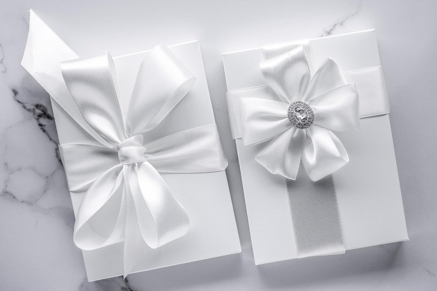 Wedding Registry Hidden Fees: What Nobody Mentions Until It Happens 15 Luxury wedding gift box with a silver-embellished silk bow on marble