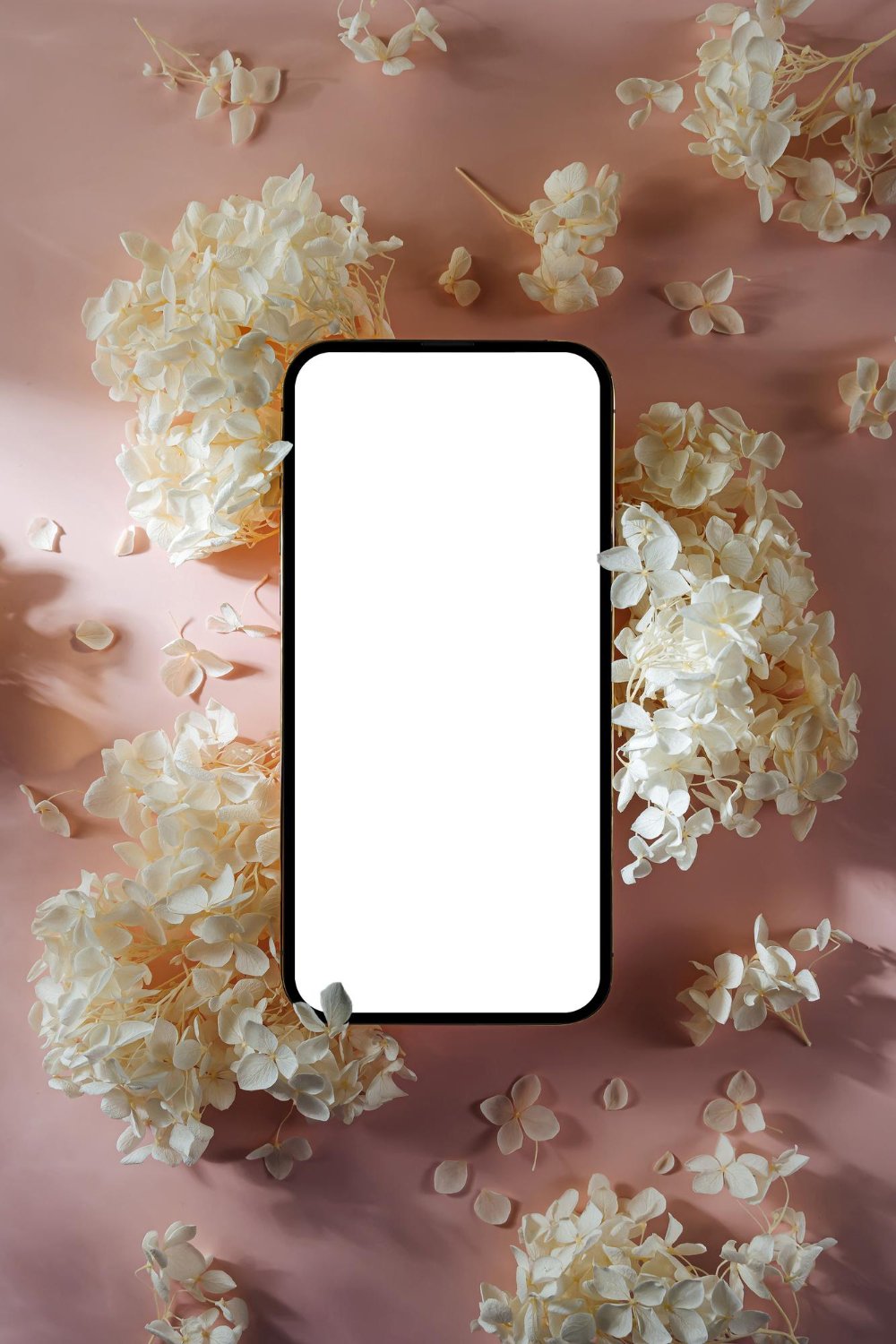 Wedding Website Privacy: What Nobody Mentions Until It's Live 12 Elegant smartphone mockup with a blank screen surrounded by soft white dried flowers