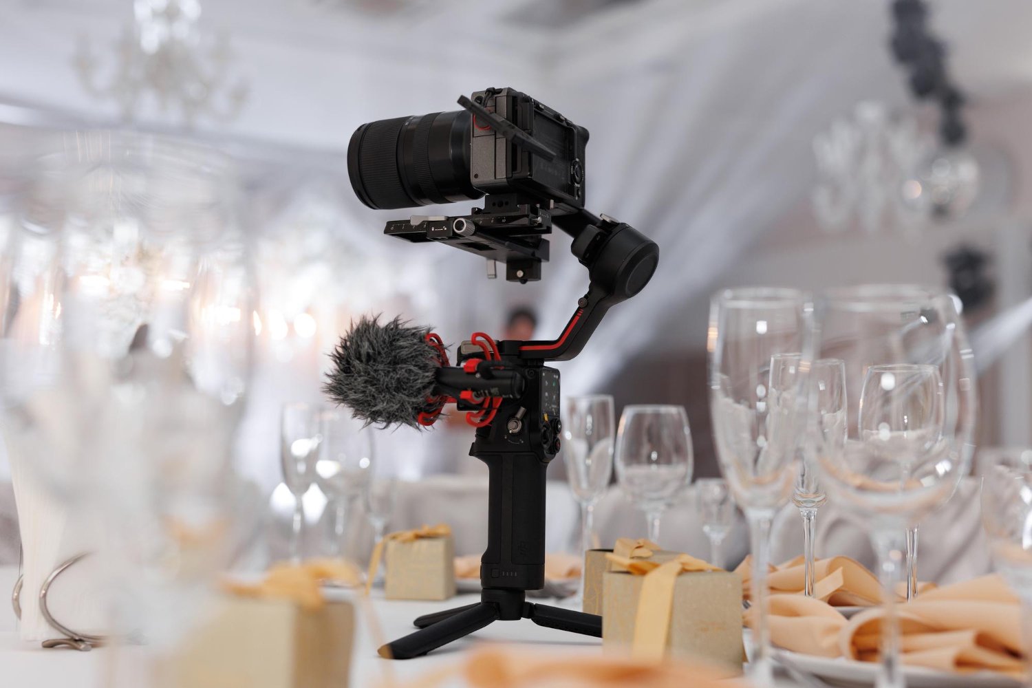 Second Photographer & Videographer Add-Ons: What They Actually Cost and Cover 12 Professional videographer's camera on a gimbal stabilizer at an elegant wedding reception